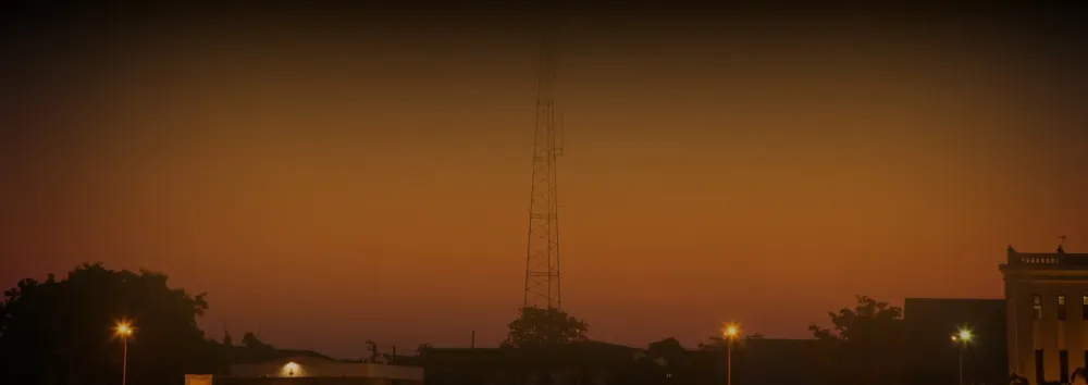 Orange banner with town near broadcast tower